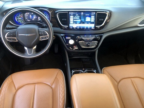 ><p>Edging toward SUV looks</p><p>The Pacifica Hybrid, redesigned for, comes in four trim levels of Touring, Touring L, Limited, and Pinnacle, the last of which Clean Fleet Report drove. Chrysler says the “new exterior design expression is much more deeply sculpted, athletic and modern in character.†The new design is sleeker than previously, with the new diamond-style grille, with gloss black paint and a tasteful bright chrome trim, which looked great against the Velvet Red Pearl paint.</p><p>The Pacifica Hybrid’s wide and low stance (5.1-inches of ground clearance) cuts a silhouette that makes people say it doesn’t look like a minivan. This will make Chrysler happy as they are calling the new design “utility-vehicle inspired.†The smooth exterior begins with LED headlights that extend wide on the fenders. Fog lamps are set low in the fascia, and chrome accents are subtle around the windows, lower doors and rear fascia. Chrysler, especially on the Pinnacle model, has raised the elegance level.</p><p>The roof has rack rails, a body color-keyed shark fin antenna, a tri-pane panoramic sunroof, and a built-in spoiler over the rear hatch. The horizontal LED tail lights, are connected by a light strip that runs the full width of the rear. The hands-free power lift gate has a low lift-over, meaning loading items is an easy task. The 10-spoke, 18-inch aluminum wheels with Baltic Gray pockets complemented the design.</p><h3>Upscale Interior</h3><p>The interior on the Pacifica Hybrid Pinnacle will cause a pause when first taking it in. A neighbor said it reminded her of her uncle’s Mercedes-Benz 450SL from years ago, which was a nice and appropriate complement. Chrysler calls the Pinnacle interior a “luxurious living room on wheels.â€</p><img width=